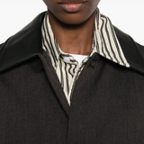 close up of brown jackets-coats, showing texture of the cotton fabric