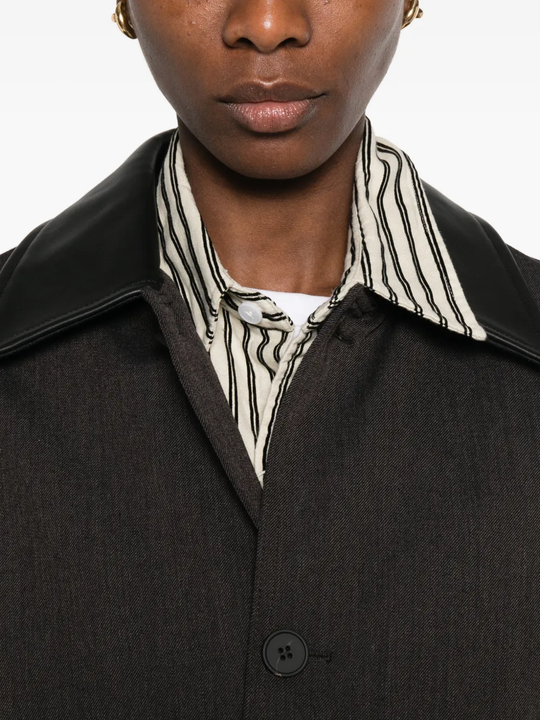 close up of brown jackets-coats, showing texture of the cotton fabric