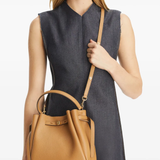 Brown bag worn by a person, showing the bag fit