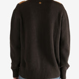 Brown sweater worn by a person, showing the sweater fit