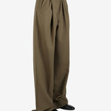 Green pant worn by a person, showing the pant's fit