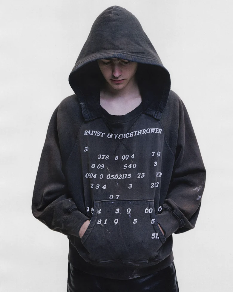 Black hoodie worn by a person, showing the hoodie fit