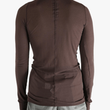 Brown t-shirt worn by a person, showing the shirt's fit