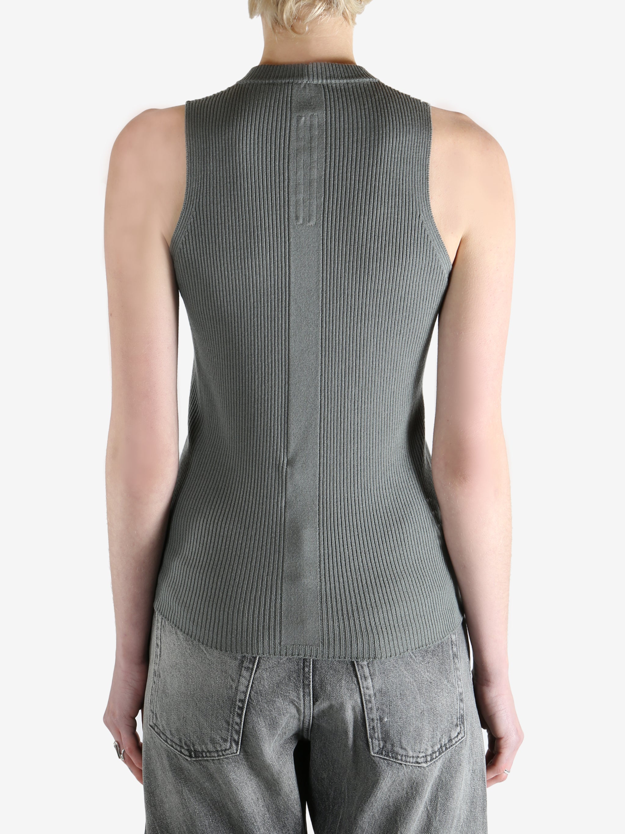 Grey tops worn by a person, showing the tops fit