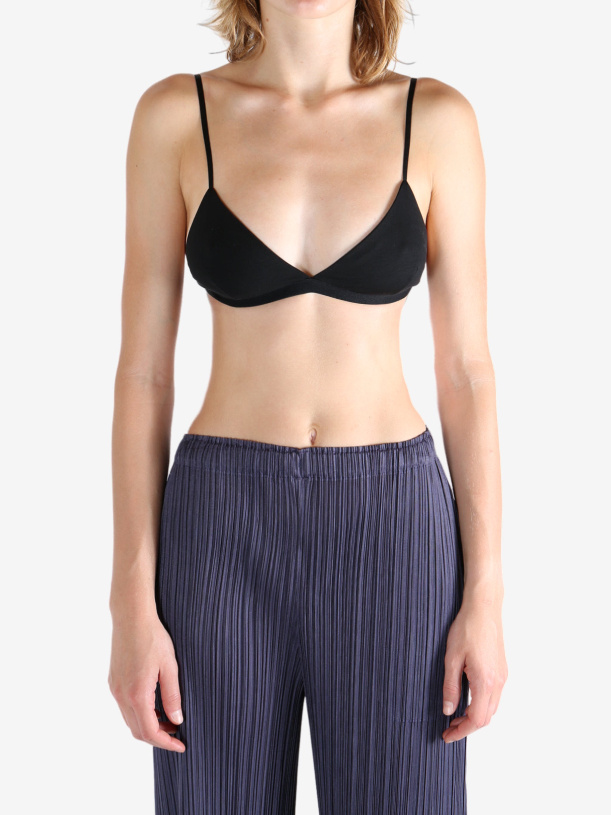 Black bra worn by a person, showing the bra's fit