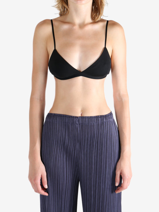 Black bra worn by a person, showing the bra's fit