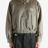 Tan jacket worn by a person, showing the jacket's fit