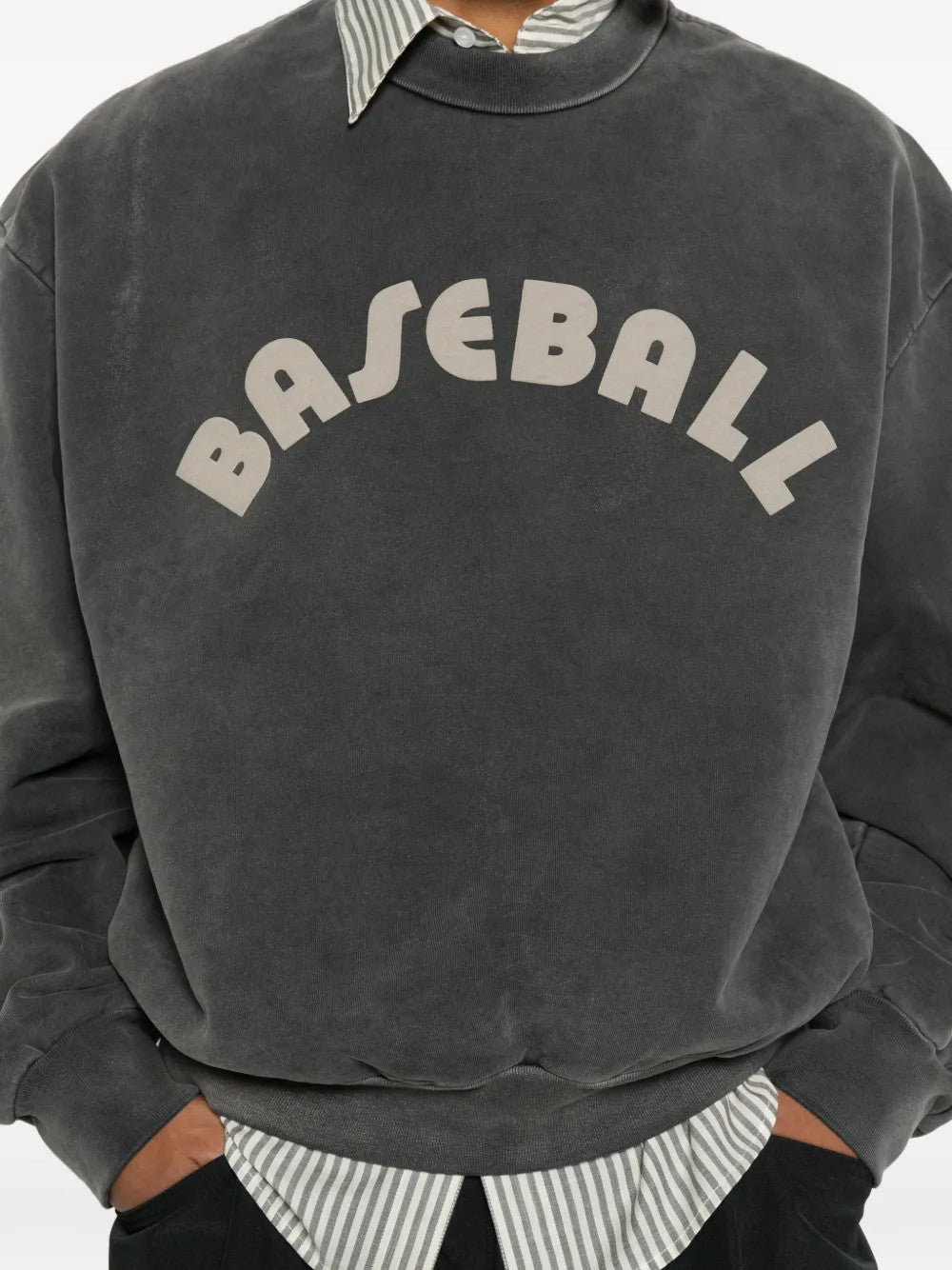 Grey hoodie worn by a person, showing the hoodie fit