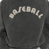 Grey hoodie worn by a person, showing the hoodie fit