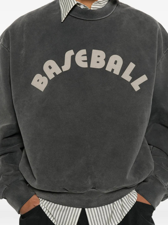 Grey hoodie worn by a person, showing the hoodie fit