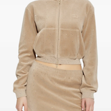 Tan hoodie worn by a person, showing the hoodie fit