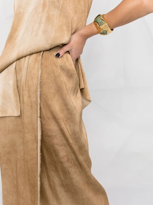 Close up of Tan skirts, showing texture of the viscose and spandex fabric