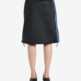 Black skirt worn by a person, showing the skirt 's fit