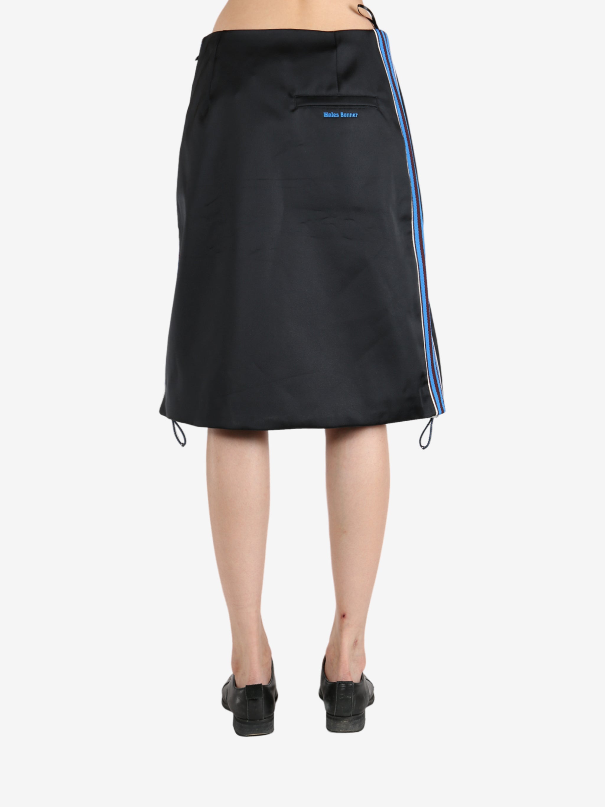 Black skirt worn by a person, showing the skirt 's fit