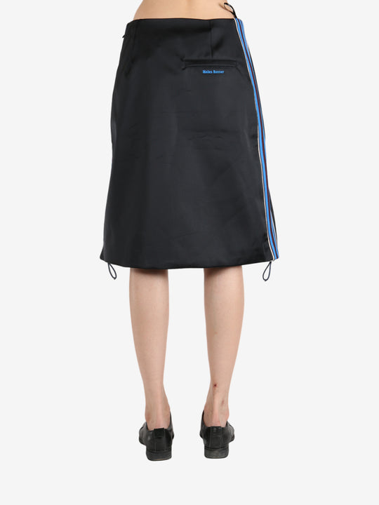 Black skirt worn by a person, showing the skirt 's fit