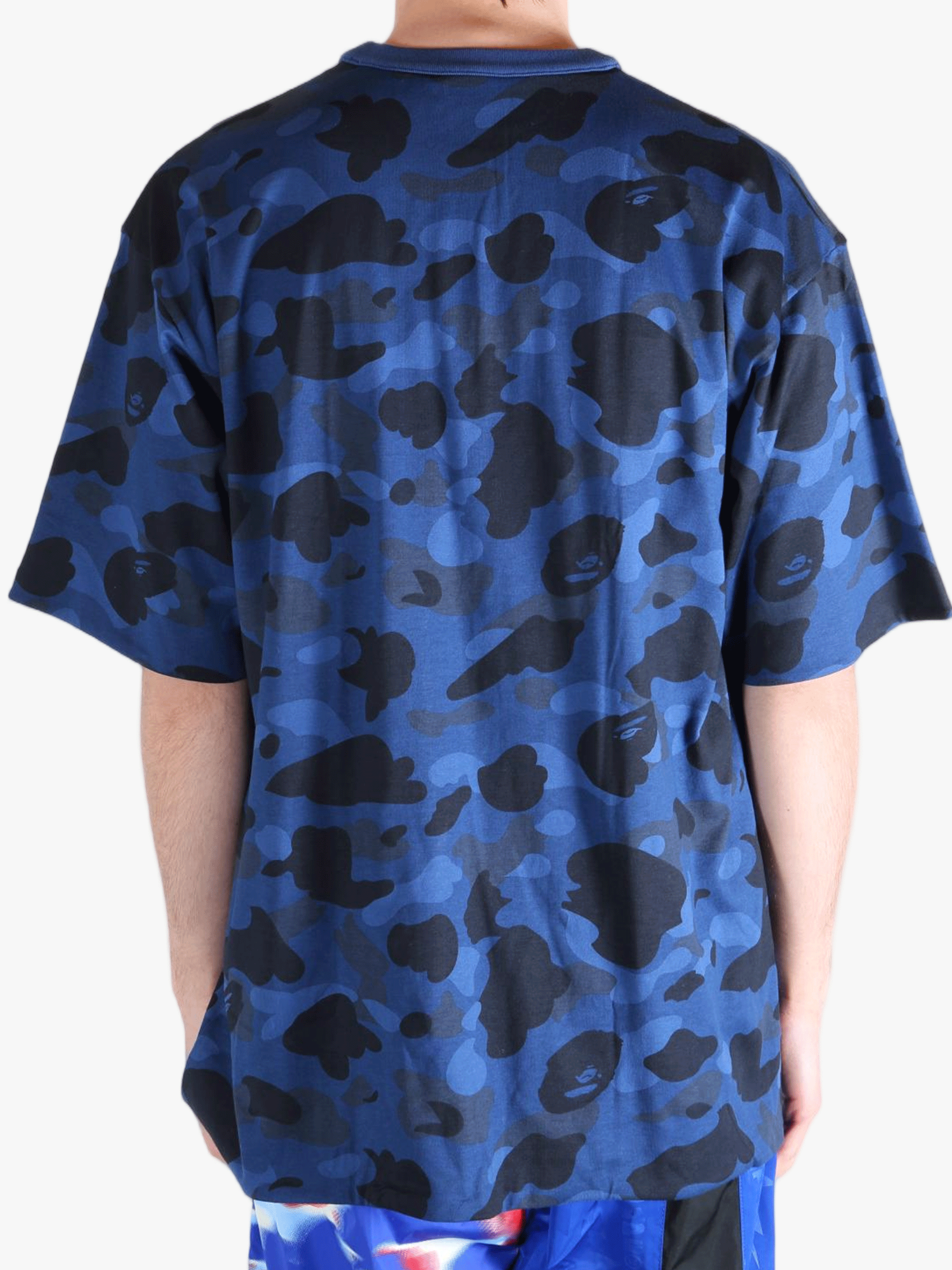 Blue t-shirt worn by a person, showing the shirt's fit