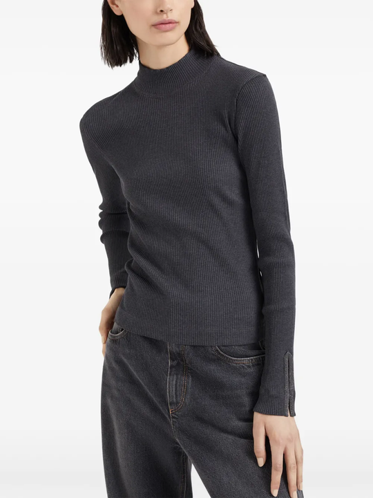 Grey tops worn by a person, showing the tops fit