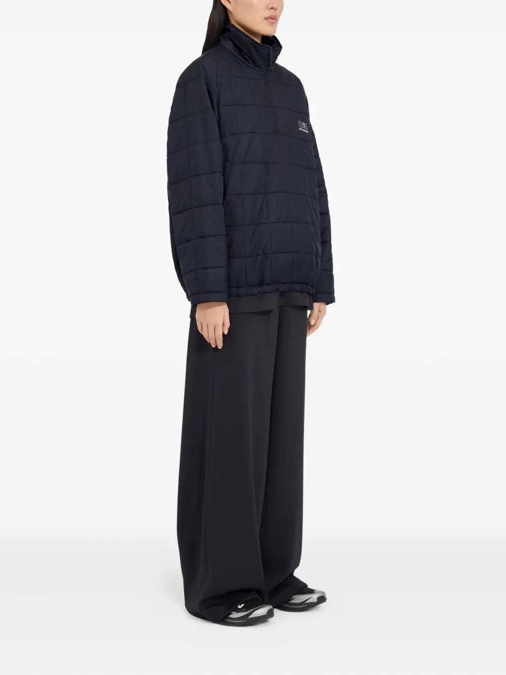 Blue jackets worn by a person, showing the jackets fit