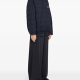 Blue jackets worn by a person, showing the jackets fit