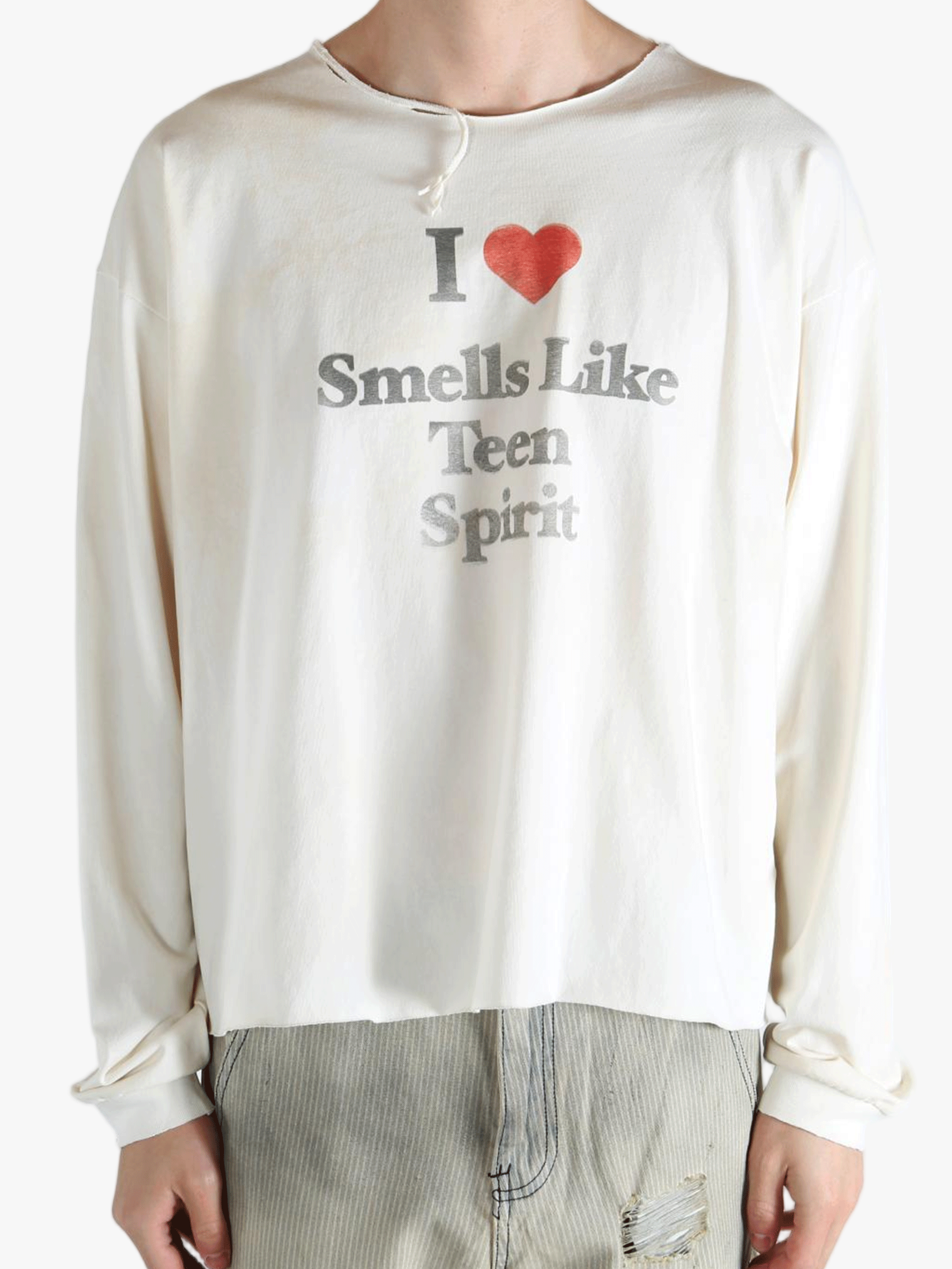 White top worn by a person, showing the top fit