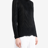 Black shirt worn by a person, showing the shirt fit