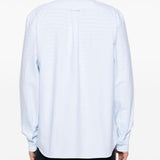 Blue shirts worn by a person, showing the shirts fit