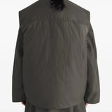 Brown coat worn by a person, showing the coat's fit