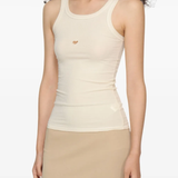 Tan tops worn by a person, showing the top fit