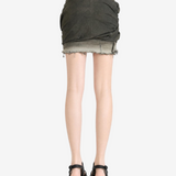 Green skirt worn by a person, showing the skirt fit