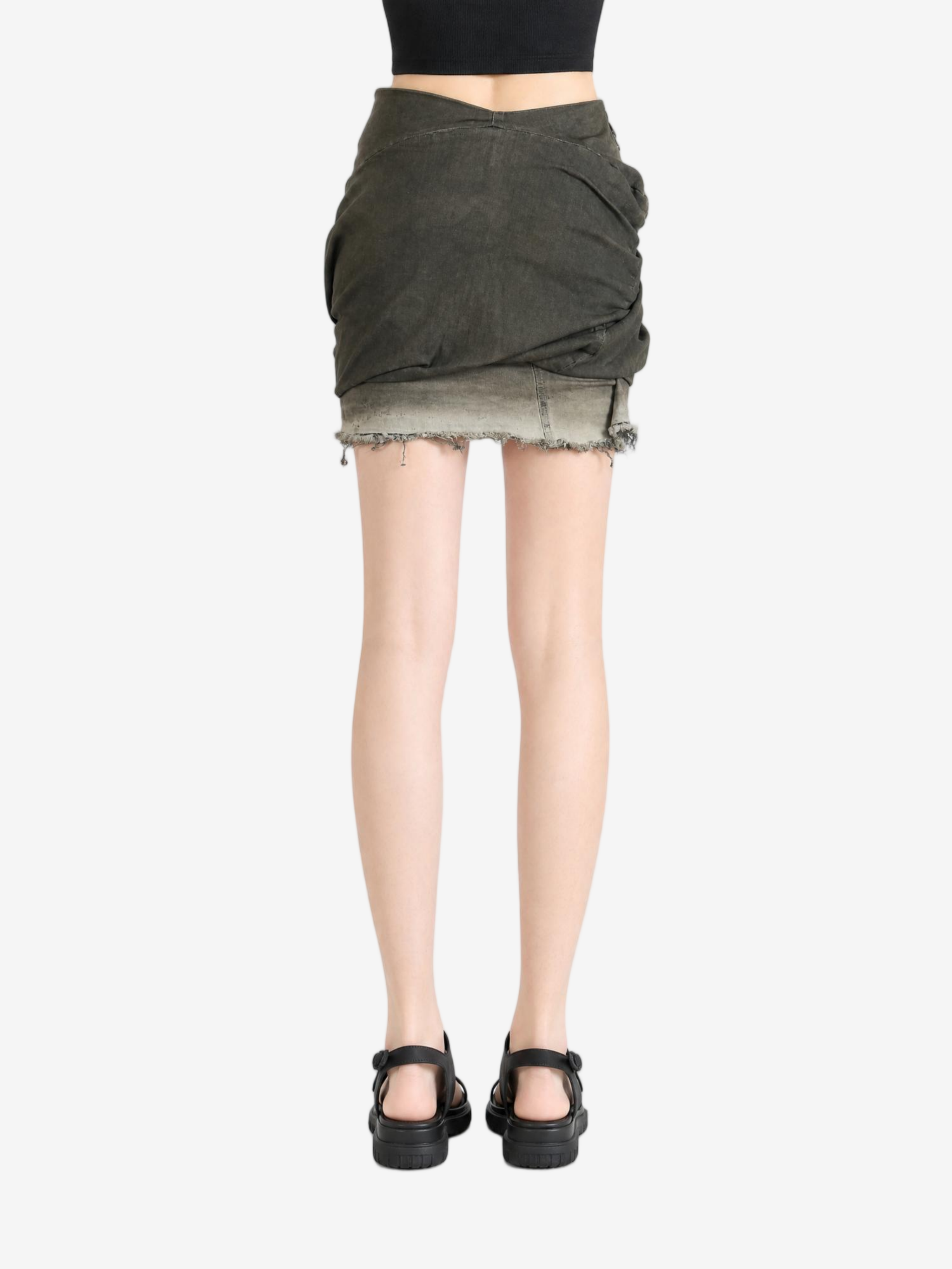 Green skirt worn by a person, showing the skirt fit
