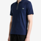 Navy shirt worn by a person, showing the shirt fit
