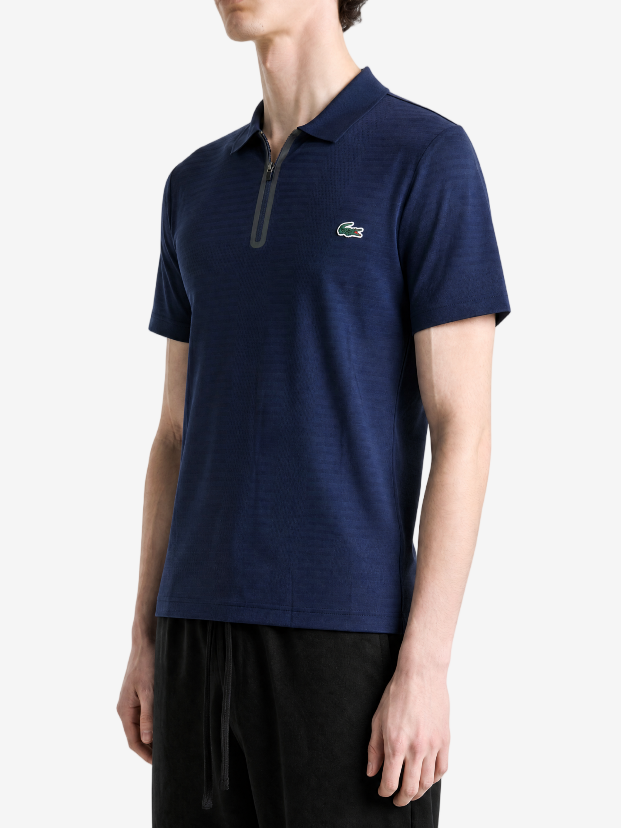 Navy shirt worn by a person, showing the shirt fit