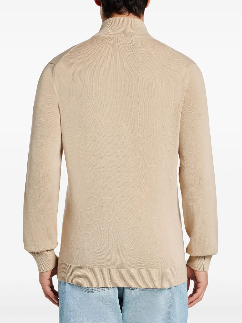 Tan sweater worn by a person, showing the sweater fit