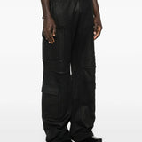 Black pants worn by a person, showing the pants fit