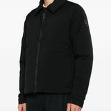 Black jacket worn by a person, showing the jacket fit