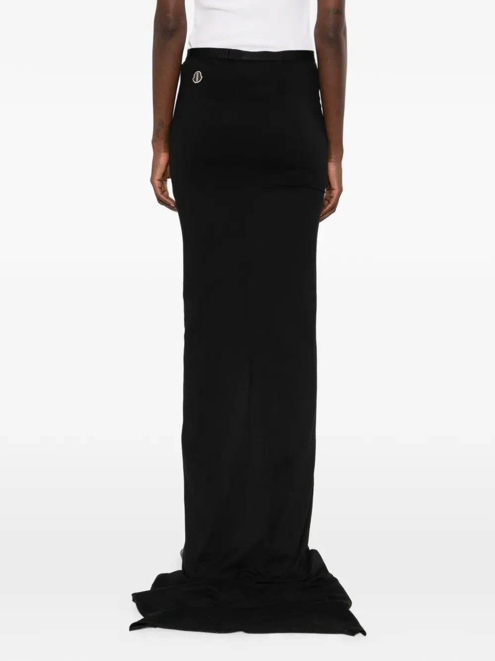 Black skirts worn by a person, showing the skirts fit