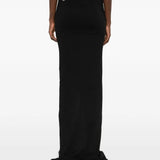 Black skirts worn by a person, showing the skirts fit