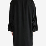 black jackets-coats worn by a person, showing the jackets-coats fit