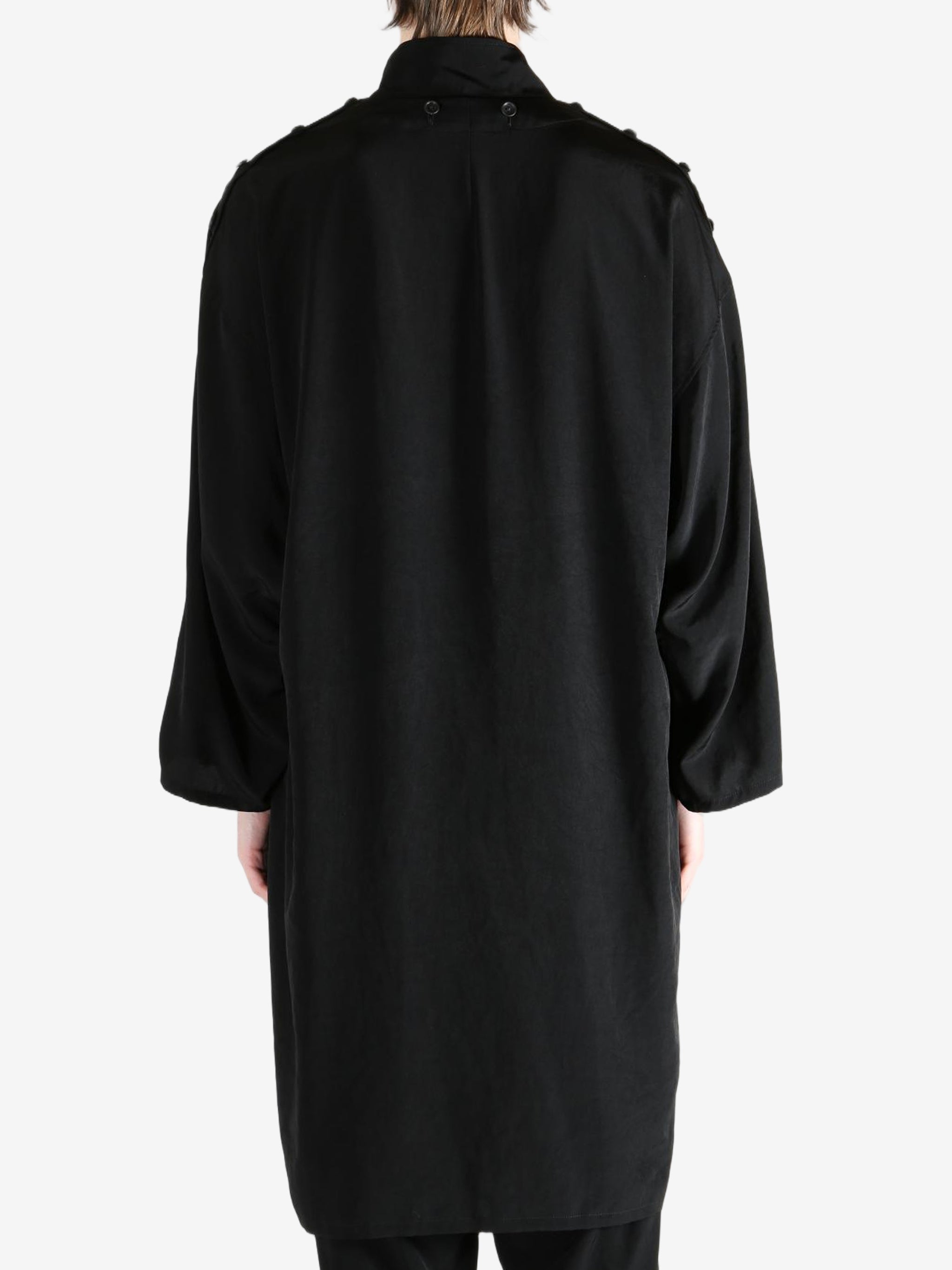 black jackets-coats worn by a person, showing the jackets-coats fit