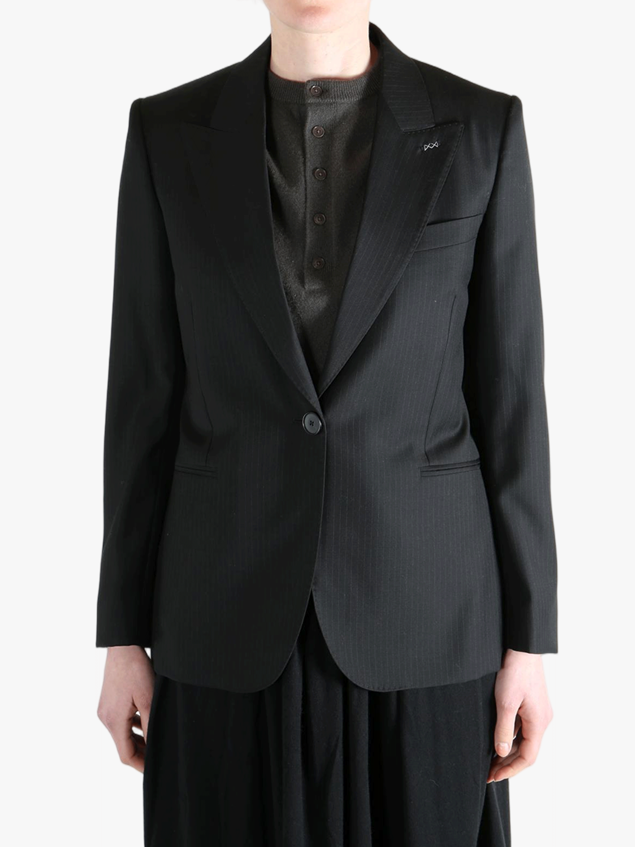 Black jacket worn by a person, showing the jacket's fit