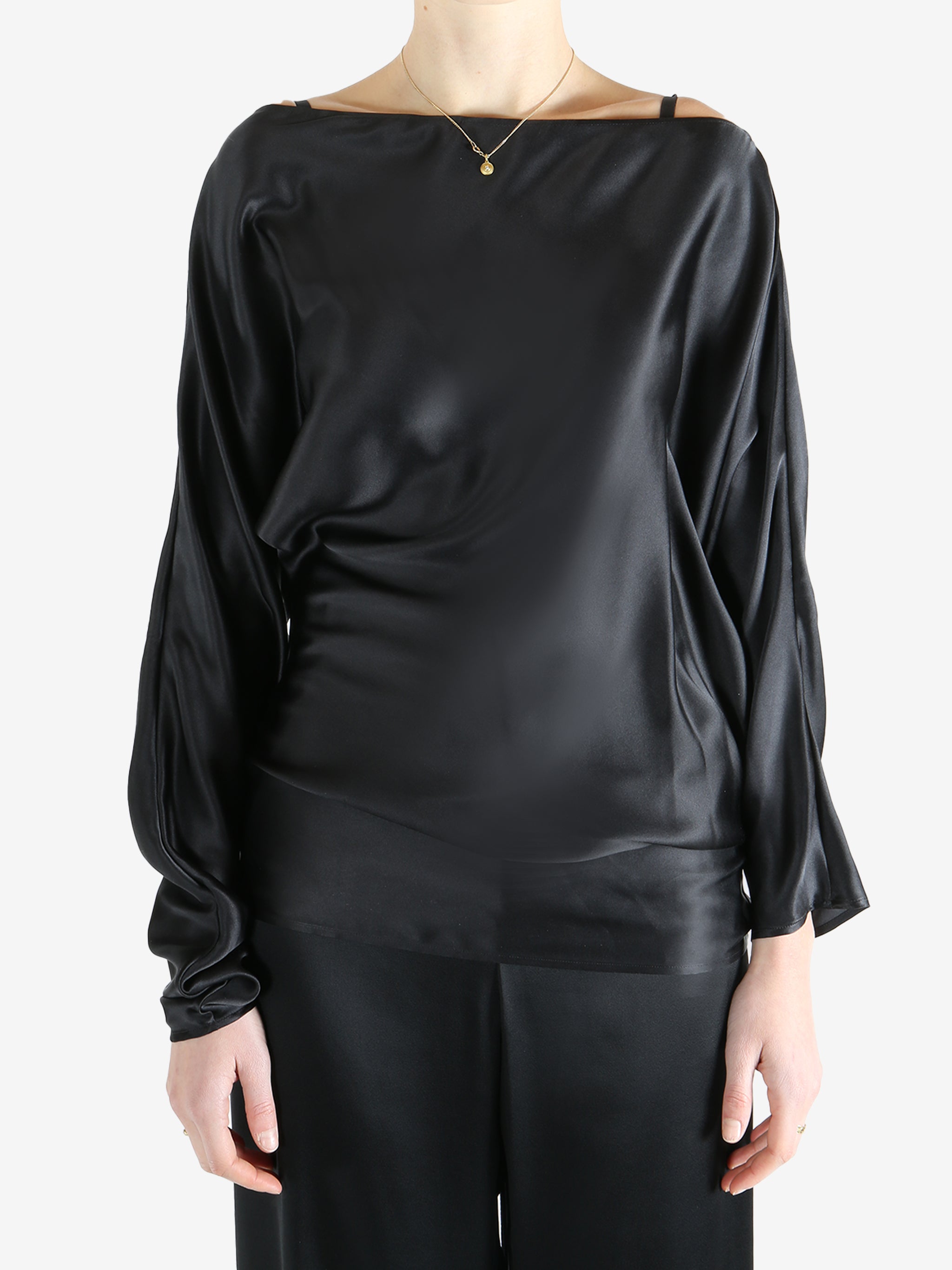 Black top worn by a person, showing the top's fit