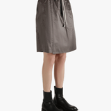 Brown shorts worn by a person, showing the shorts fit