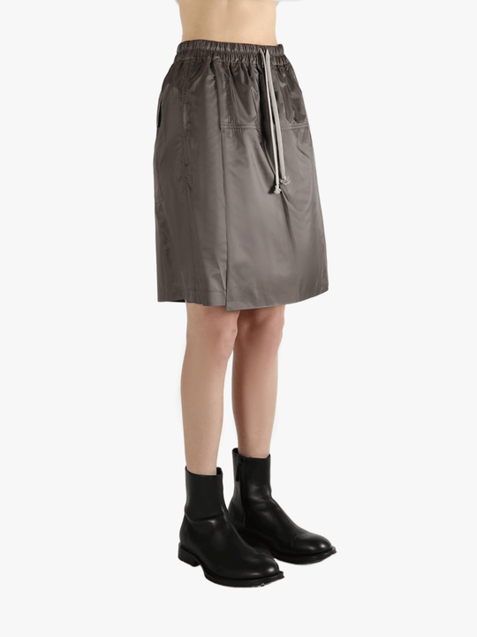 Brown shorts worn by a person, showing the shorts fit