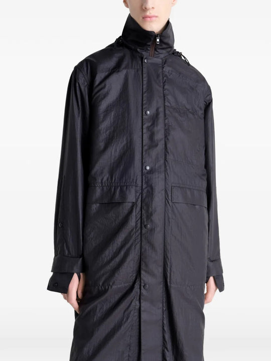 Close up of the black coat, showing texture of the nylon fabric