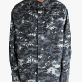 Black shirt worn by a person, showing the fit