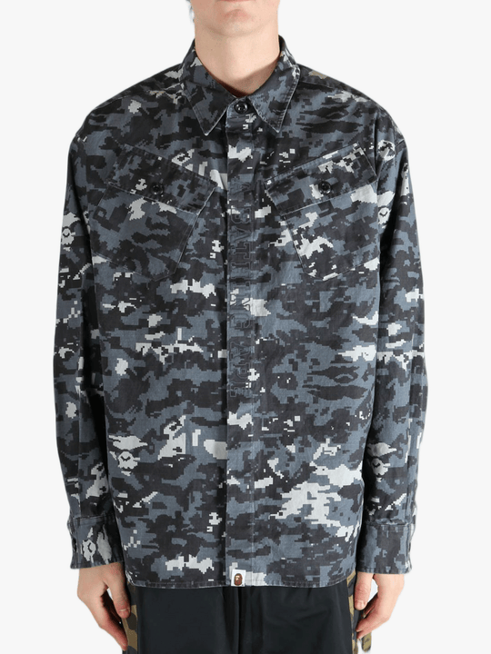 Black shirt worn by a person, showing the fit