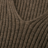 Close up of brown sweater, showing the detial of V-neck