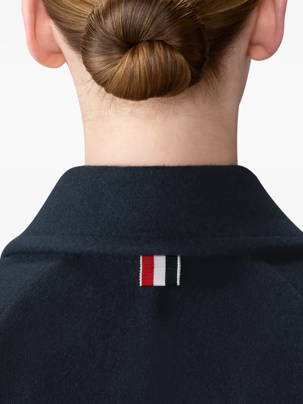 Close up of navy jacket, showing texture of the wool and Polyamide fabric