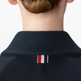 Close up of navy jacket, showing texture of the wool and Polyamide fabric