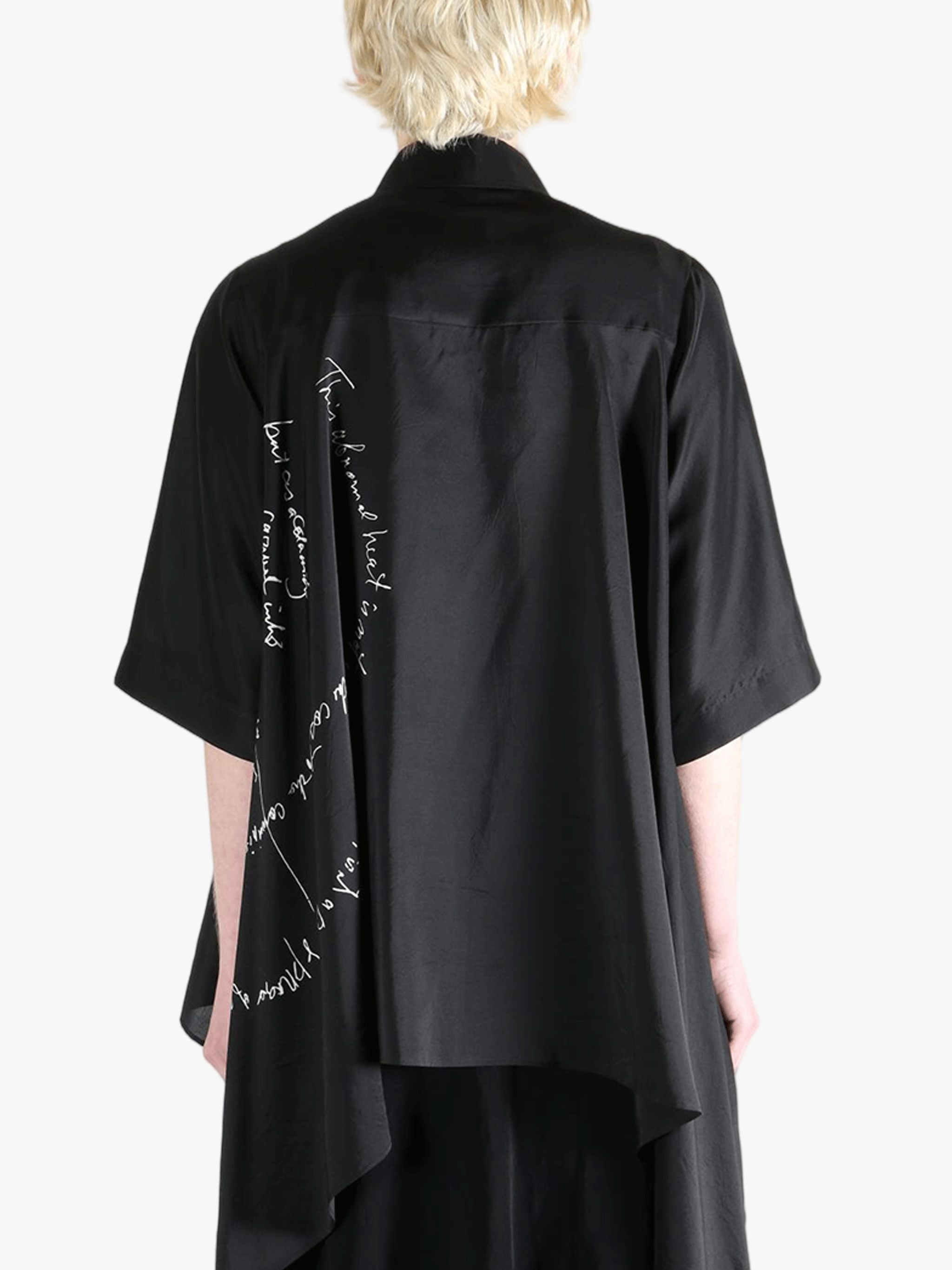 Black shirt worn by a person, showing the shirt's fit